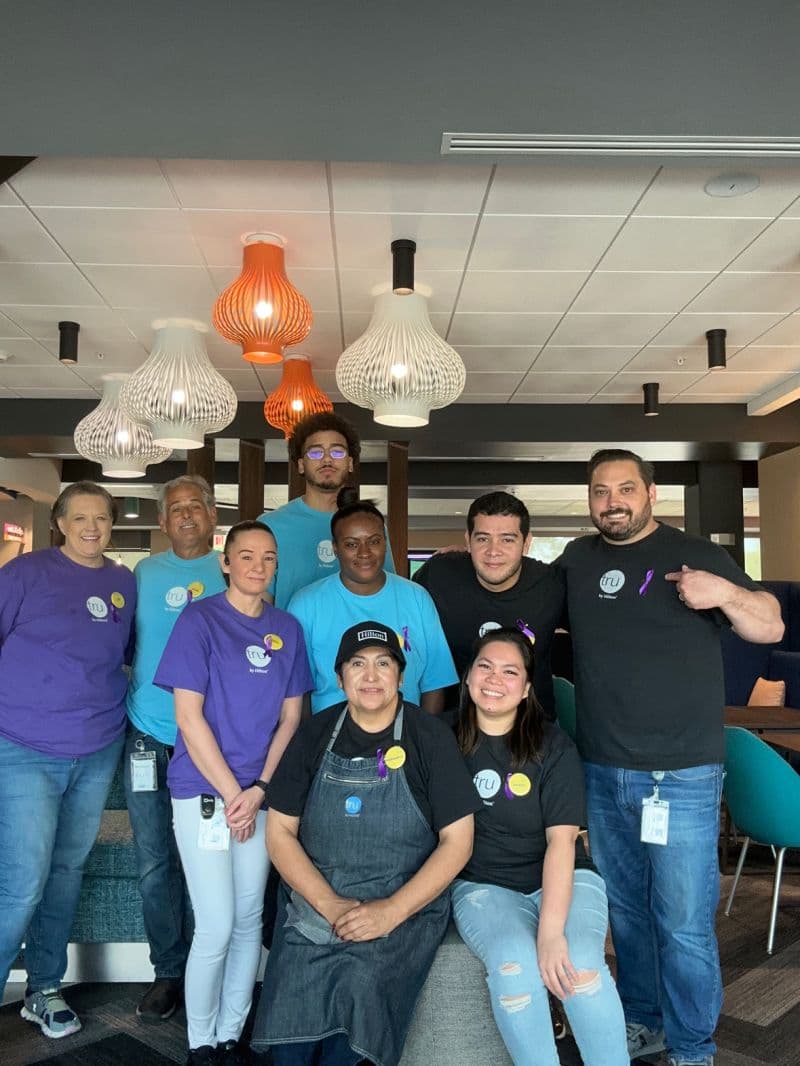 Hilton team members in coordinated company uniforms