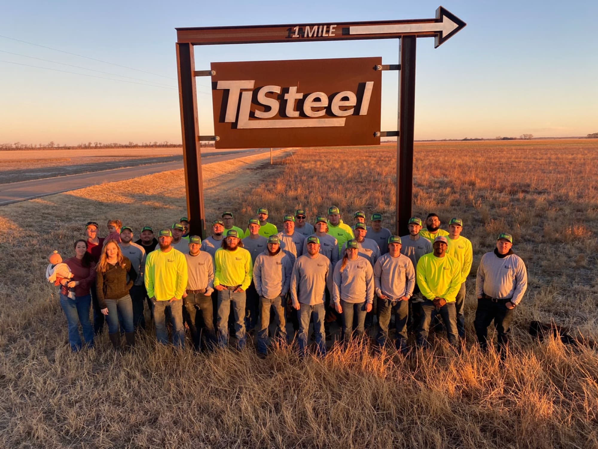 TL Steel employees in a coordinated apparel program