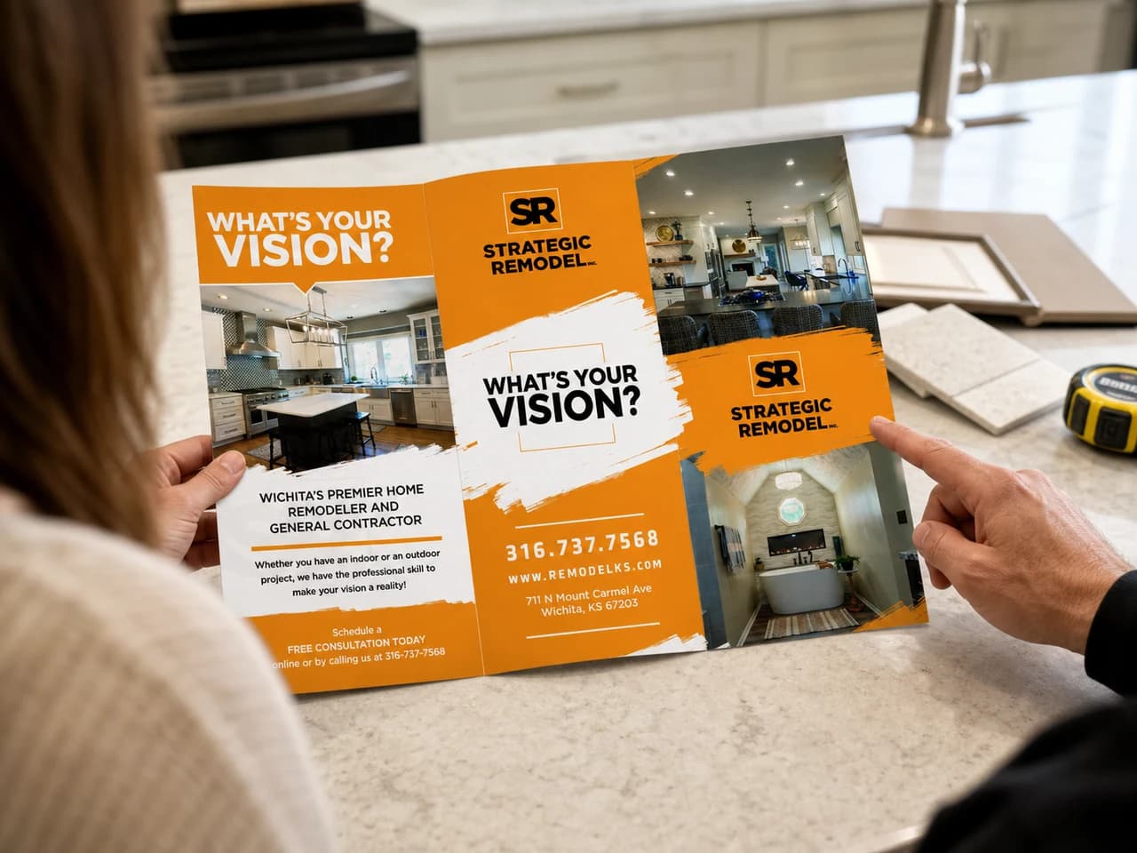Strategic Remodel brochure reviewed during a kitchen consultation